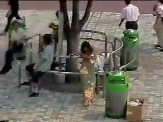 Changing in the street - Japanese young girlfriend in public first part